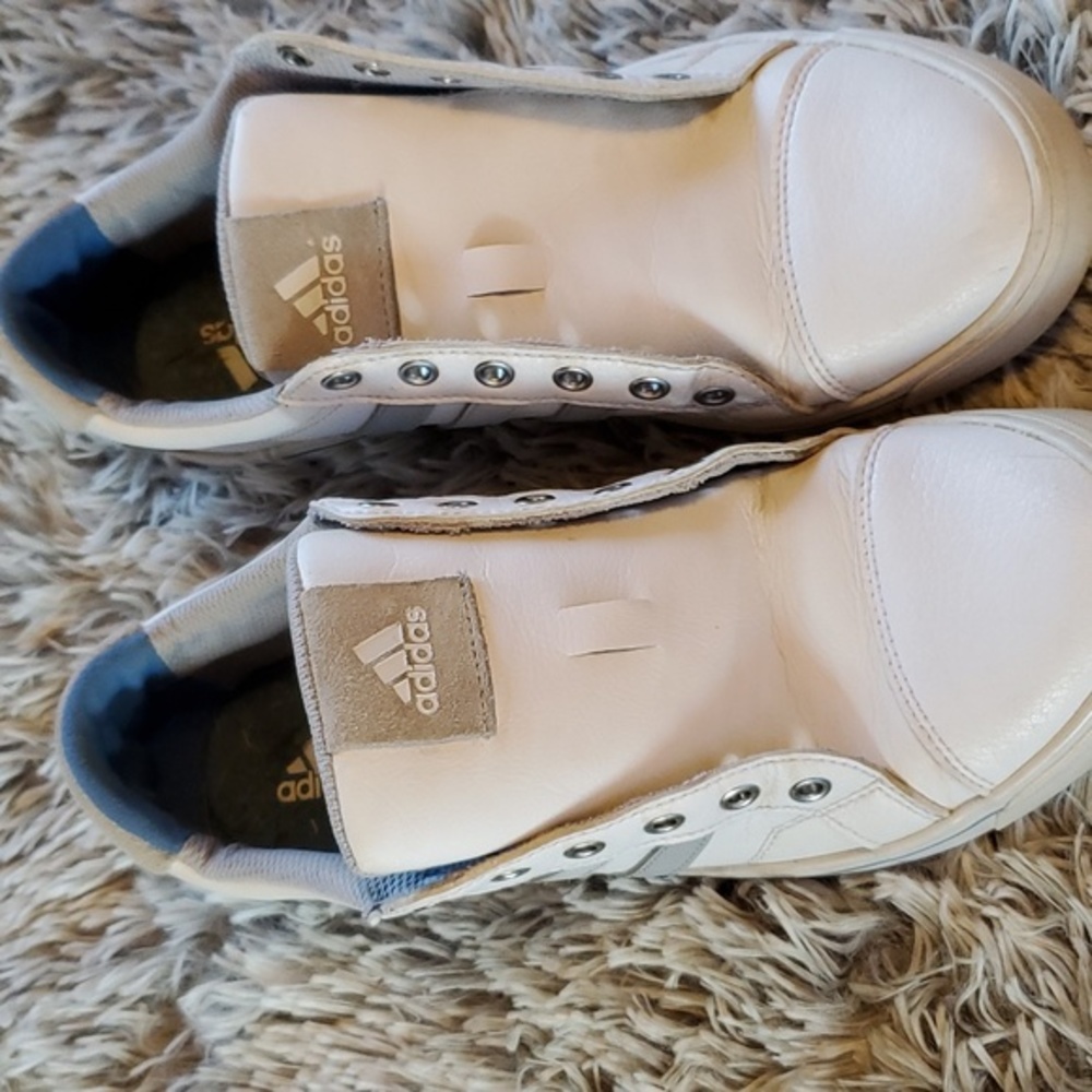 Adidas golf shoes.‎
